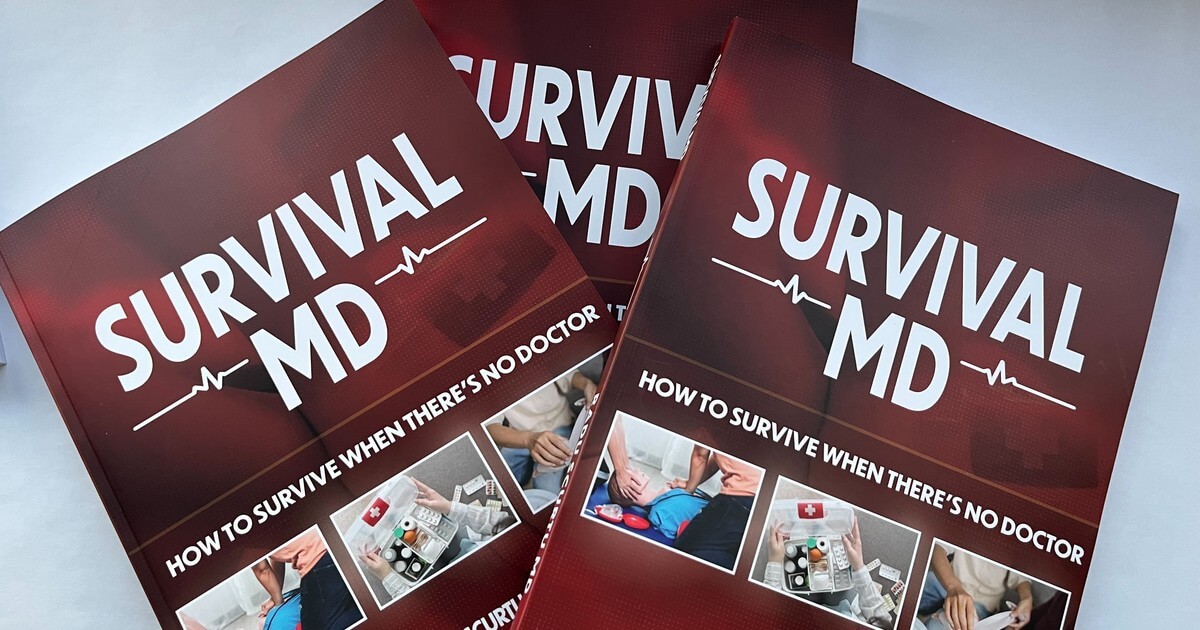 Several copies of the Survival MD book by Dr. Radu Scurtu on a table